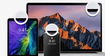 LumiSnap fixată pe un telefon, o tabletă și un laptop